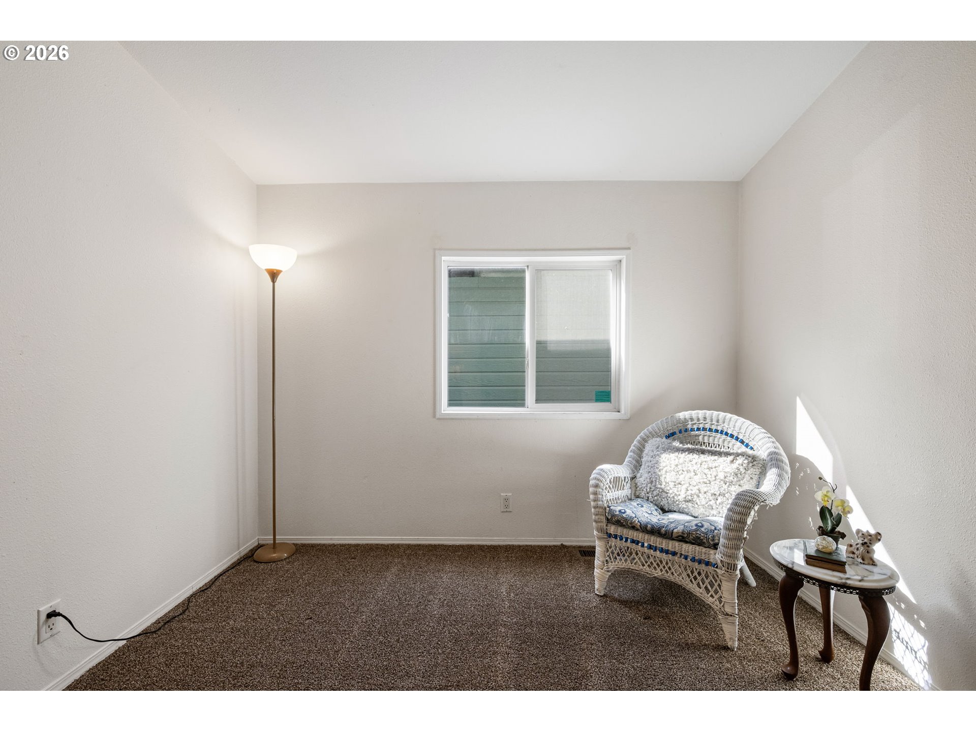 1699 North Terry Street, Unit 320 Eugene, OR 97402 - Photo 30 of 36 a living room with furniture and a window
