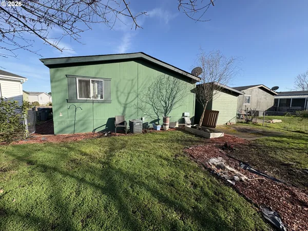 a backyard of a house with lots of green space