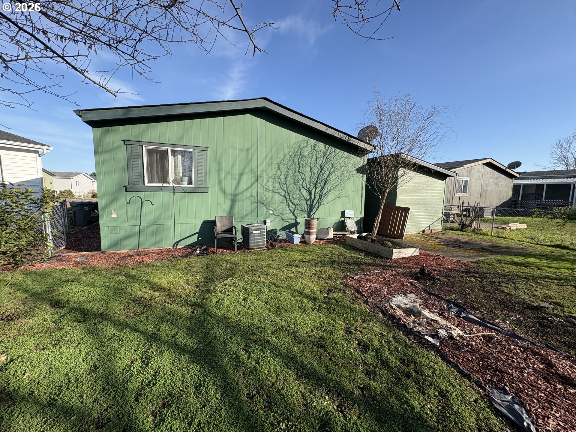 1699 North Terry Street, Unit 320 Eugene, OR 97402 - Photo 3 of 36 a backyard of a house with lots of green space
