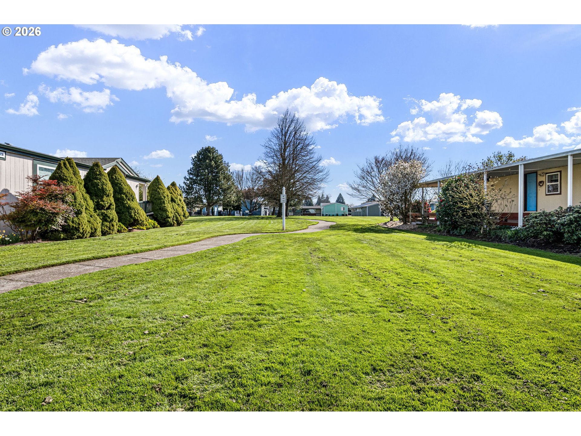 1699 North Terry Street, Unit 320 Eugene, OR 97402 - Photo 31 of 36 a view of a house with a big yard