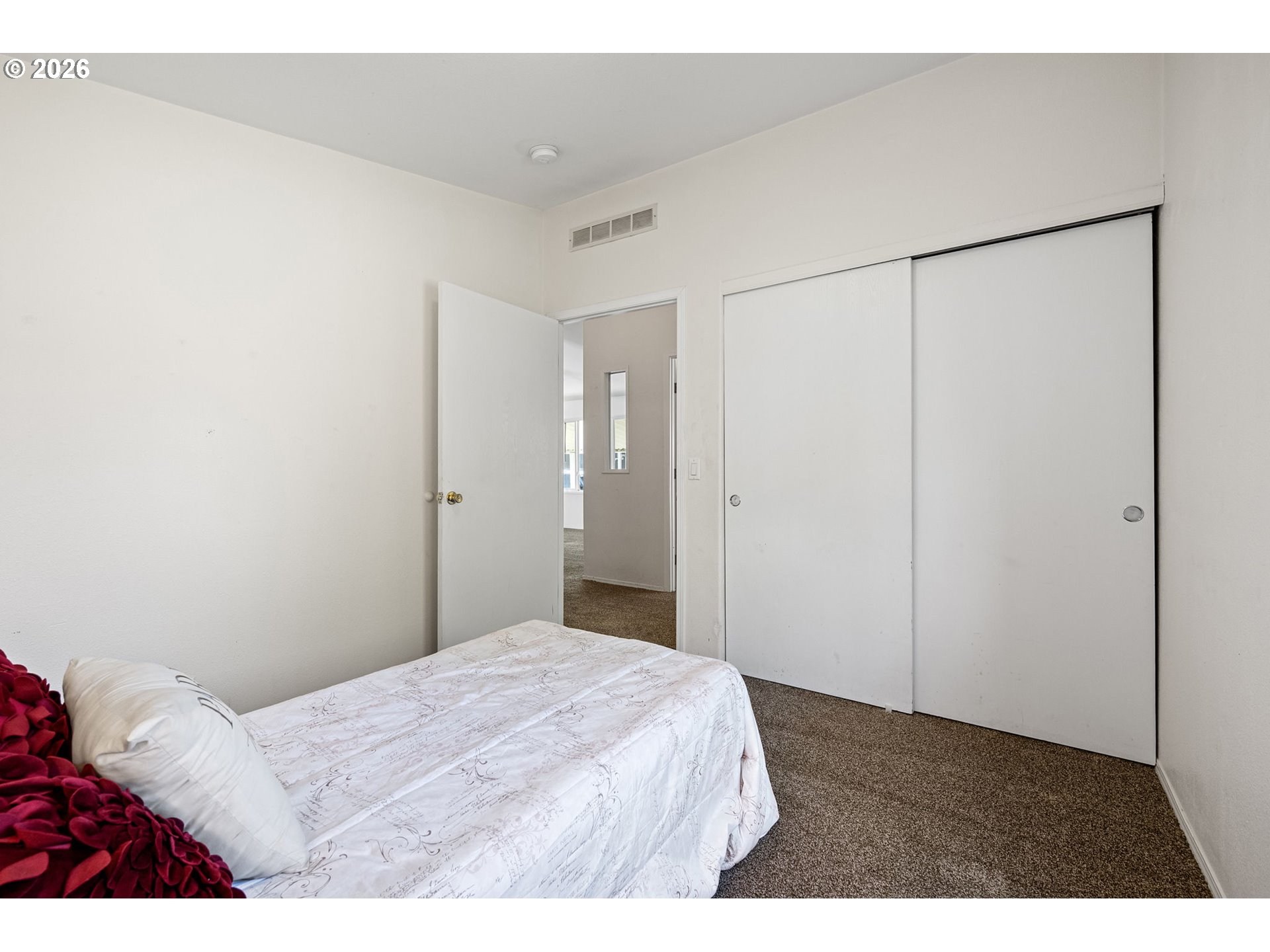 1699 North Terry Street, Unit 320 Eugene, OR 97402 - Photo 32 of 36 a bedroom with a bed and a shower