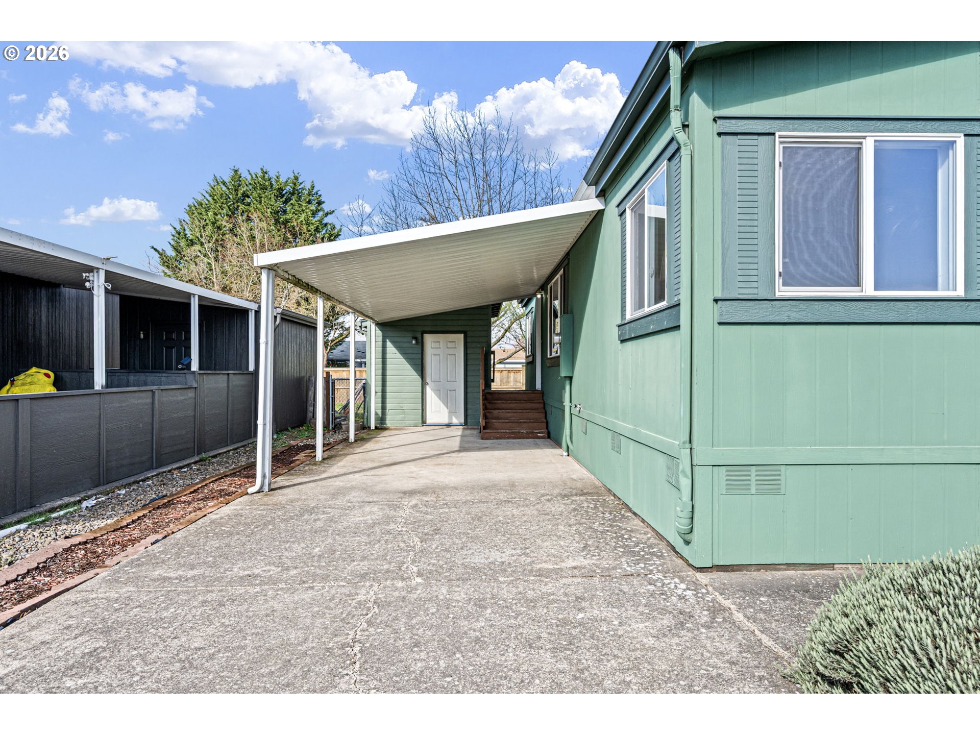 1699 North Terry Street, Unit 320 Eugene, OR 97402 - Photo 36 of 36 a front view of a house with a garden