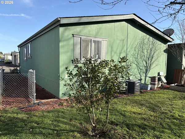 a backyard of a house with lots of green space