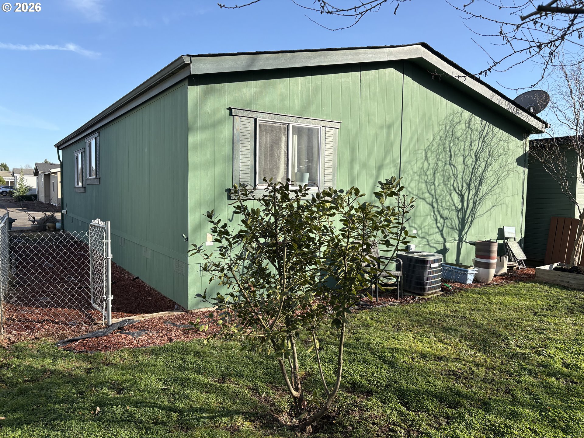 1699 North Terry Street, Unit 320 Eugene, OR 97402 - Photo 4 of 36 a backyard of a house with lots of green space