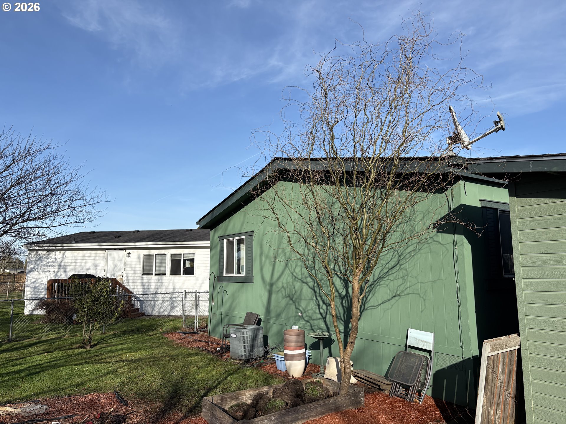 1699 North Terry Street, Unit 320 Eugene, OR 97402 - Photo 5 of 36 a view of a house with a yard