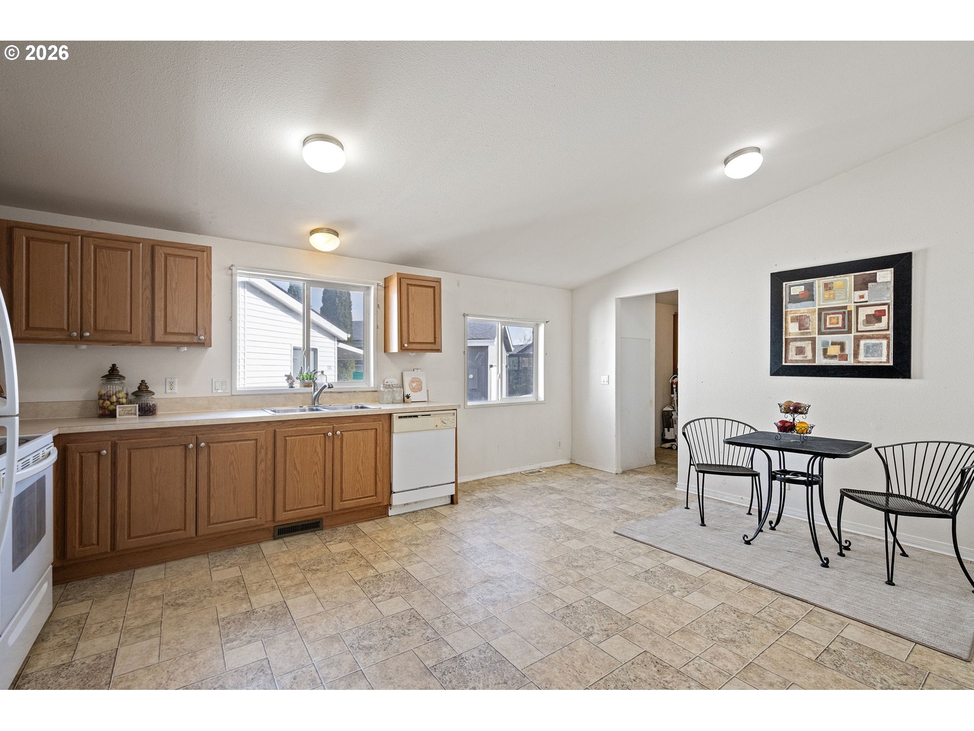 1699 North Terry Street, Unit 320 Eugene, OR 97402 - Photo 10 of 36 a kitchen with cabinets and window