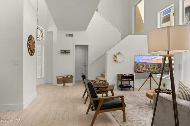 a living room with furniture and a large window