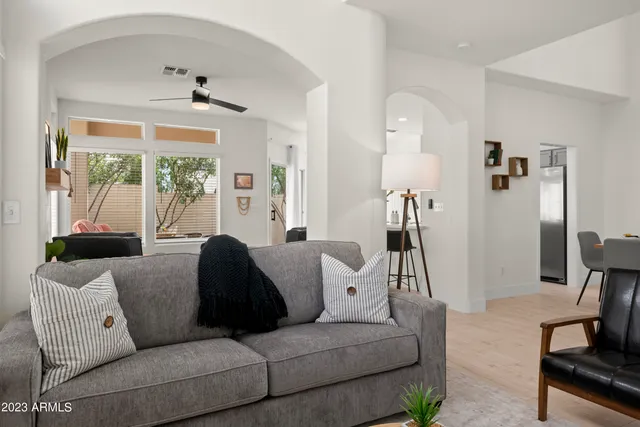 a living room with furniture a rug and a fireplace