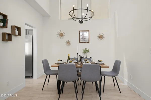 a dining room with furniture and wooden floor