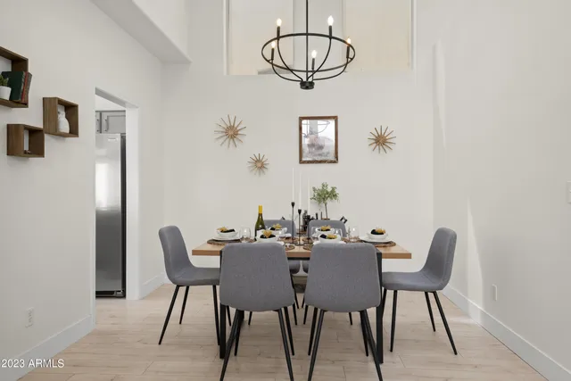 a dining room with furniture and wooden floor