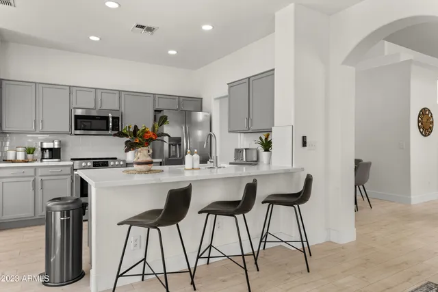 a bedroom with a bed and large window