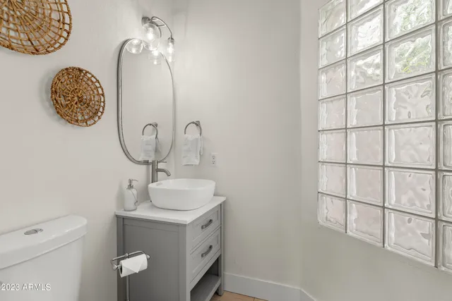 a bathroom with a shower and a sink