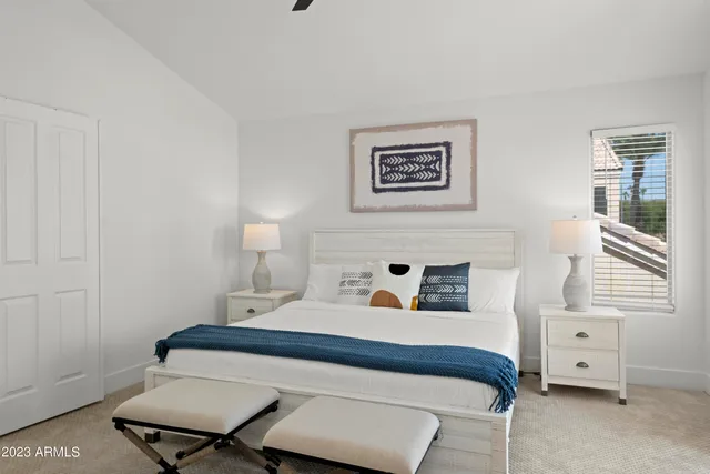 a view of a bedroom from a hallway