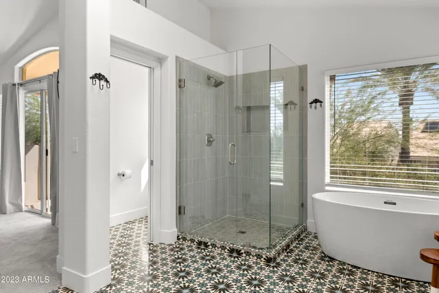 a bathroom with a granite countertop sink a toilet and a mirror