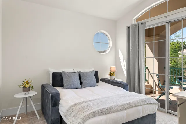 a view of a chairs and table in patio