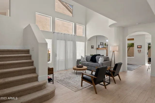 a view of a livingroom with furniture and a flat screen tv