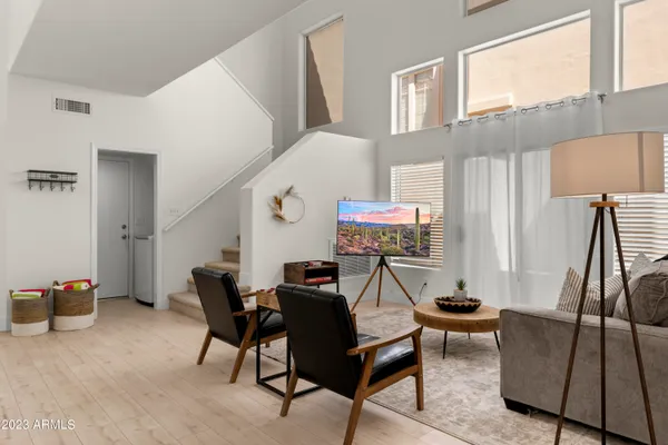 a view of a dining room with furniture and wooden floor