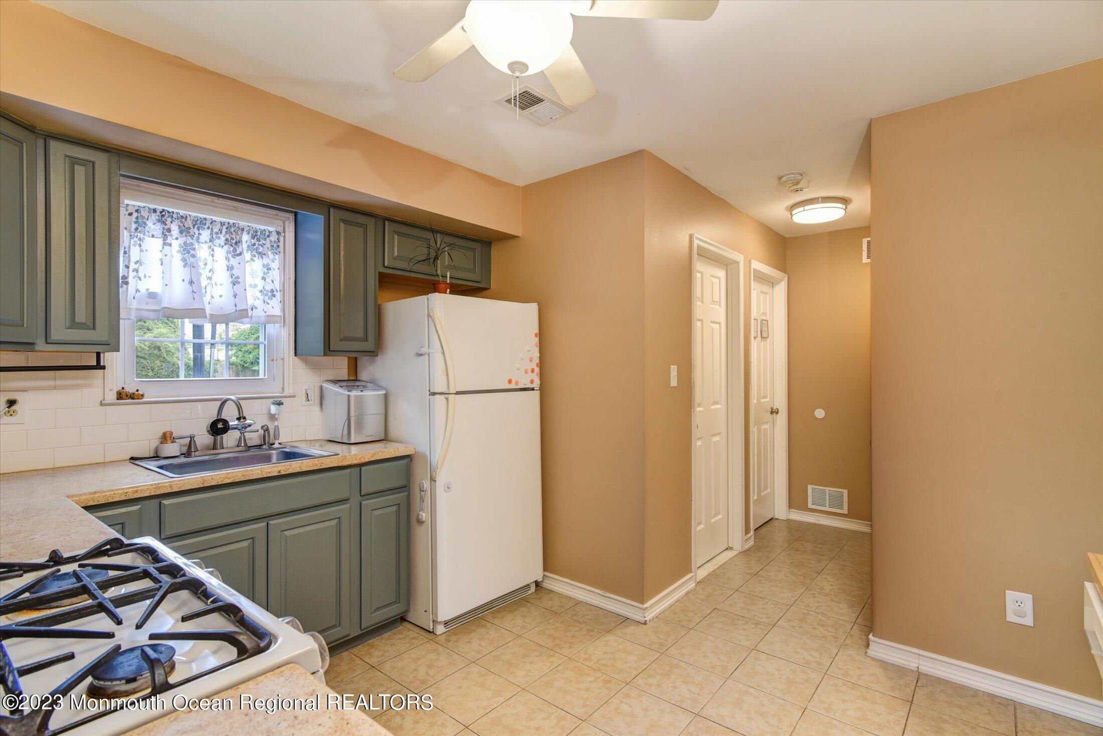 3 Albatross Drive Howell, NJ 07731 - Photo 14 of 29 a room that has a lot of furniture and window in it