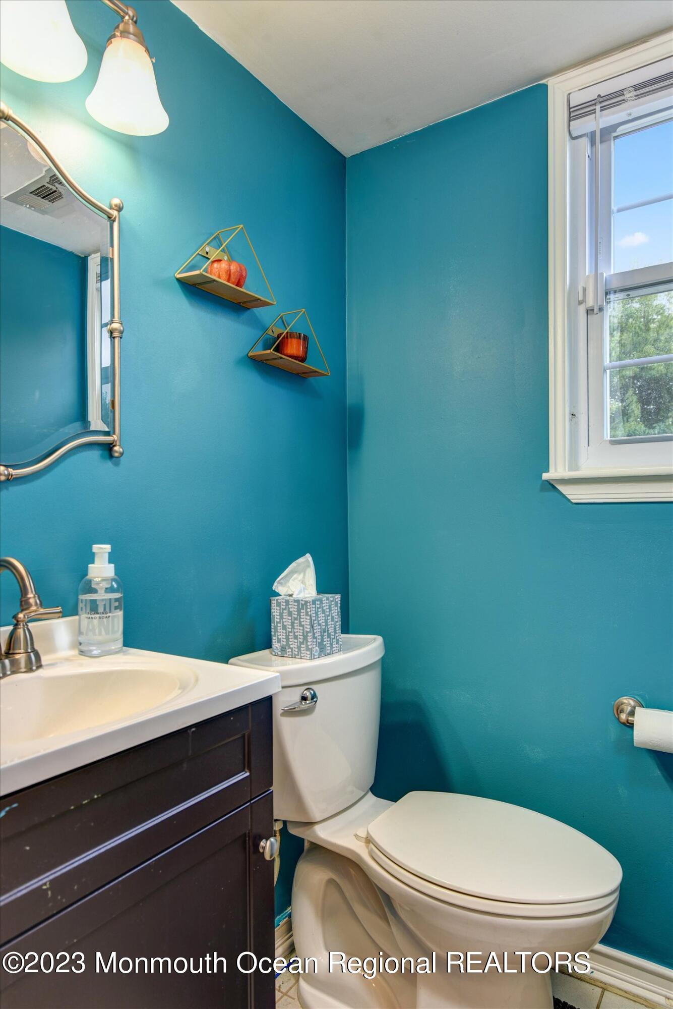 3 Albatross Drive Howell, NJ 07731 - Photo 17 of 29 a bathroom with a toilet a sink and a mirror