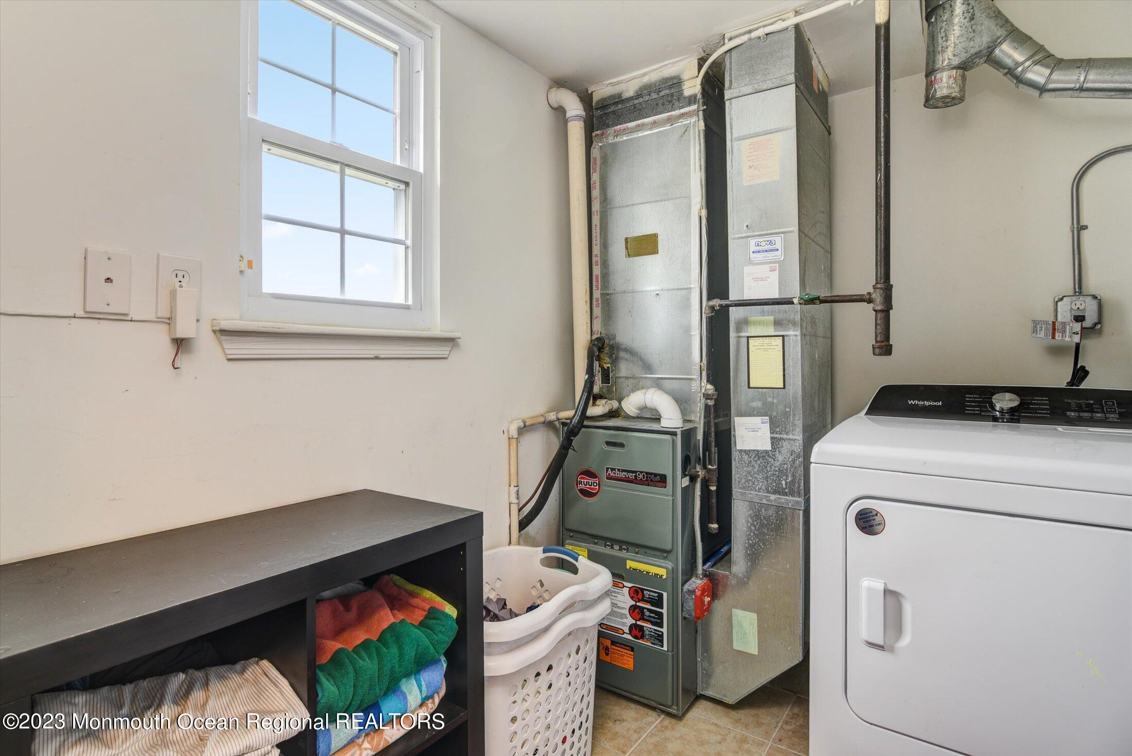 3 Albatross Drive Howell, NJ 07731 - Photo 18 of 29 a view of storage and utility room with washer and dryer