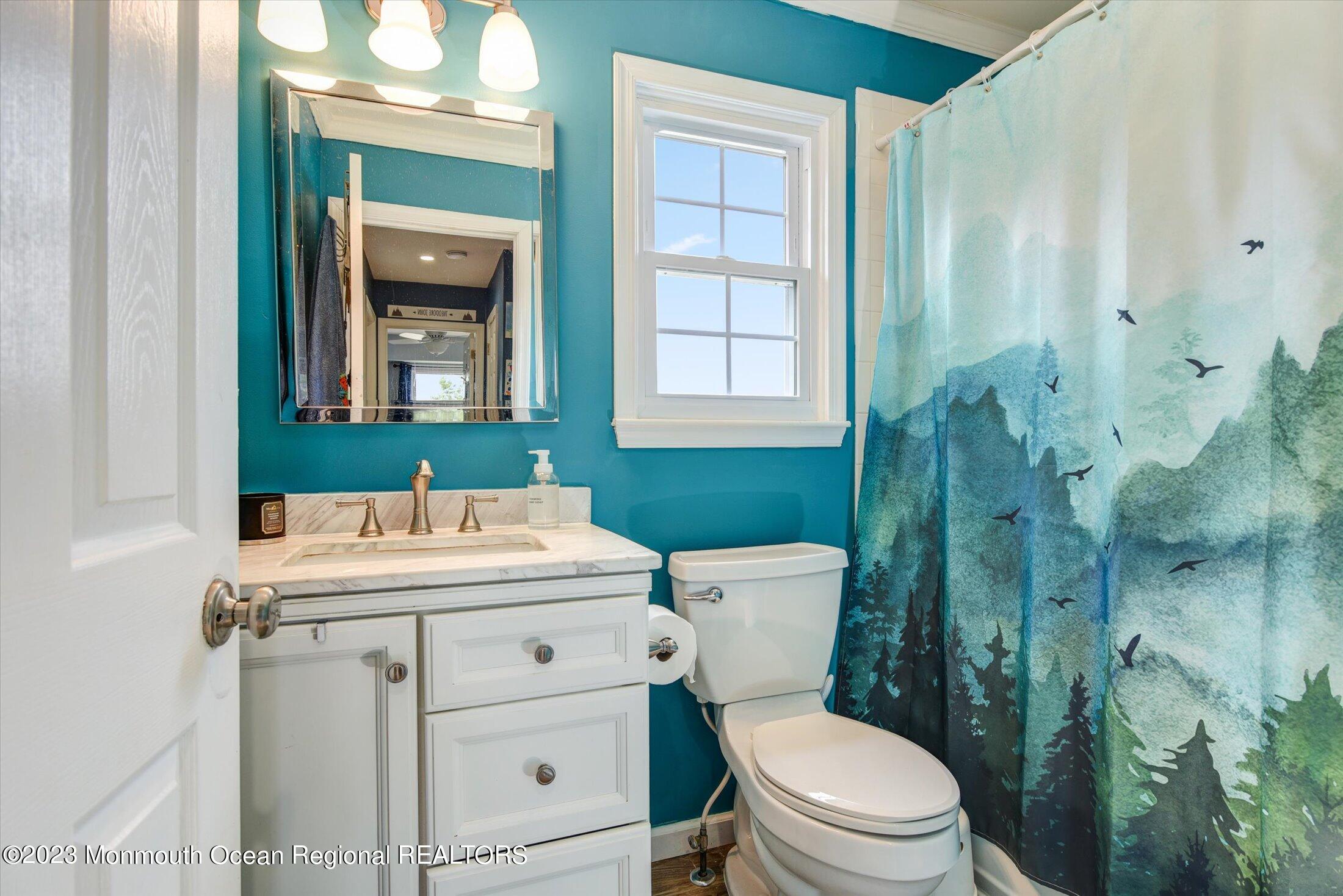 3 Albatross Drive Howell, NJ 07731 - Photo 20 of 29 a bathroom with a sink a toilet and shower