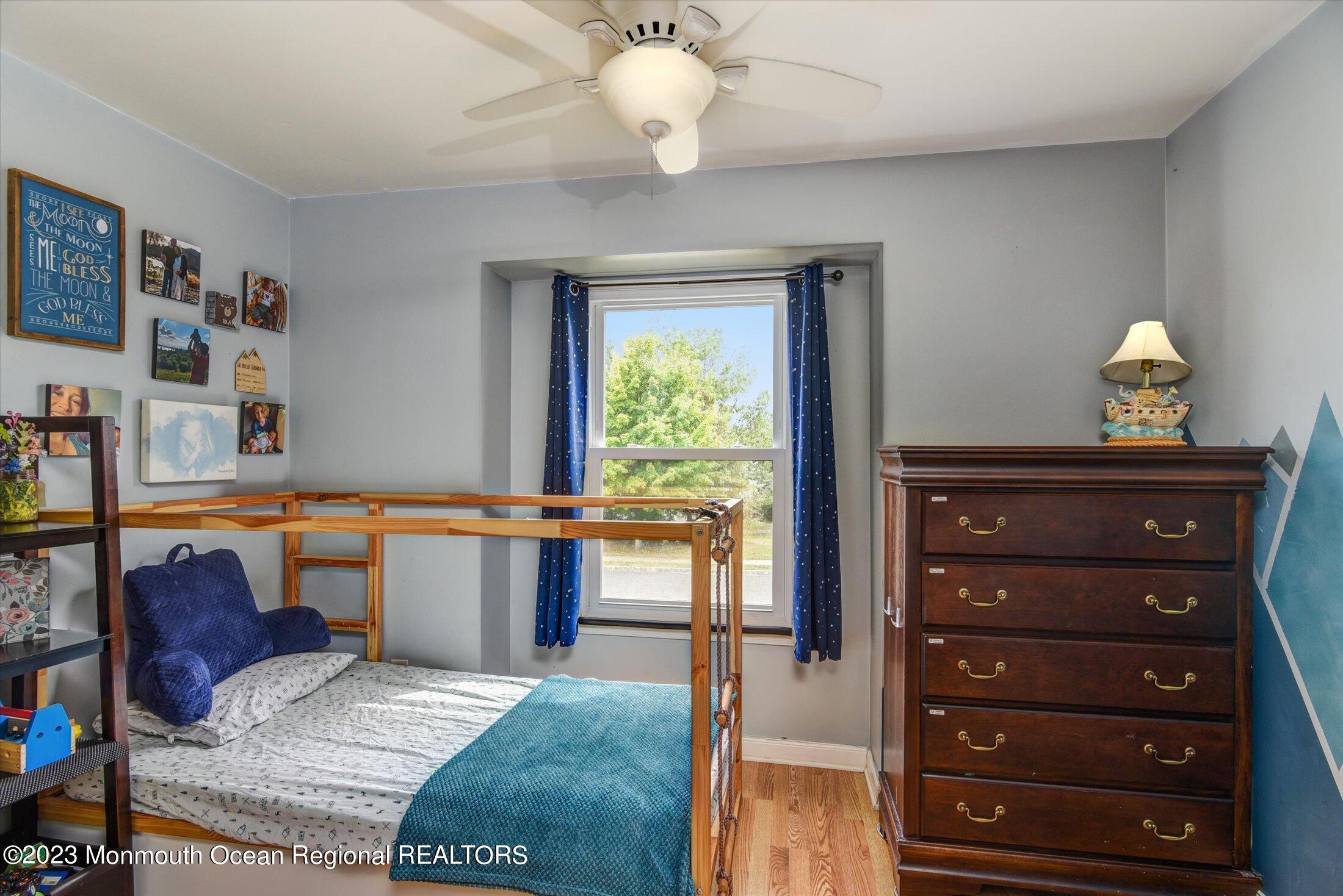 3 Albatross Drive Howell, NJ 07731 - Photo 24 of 29 a living room with a couch and a bookshelf