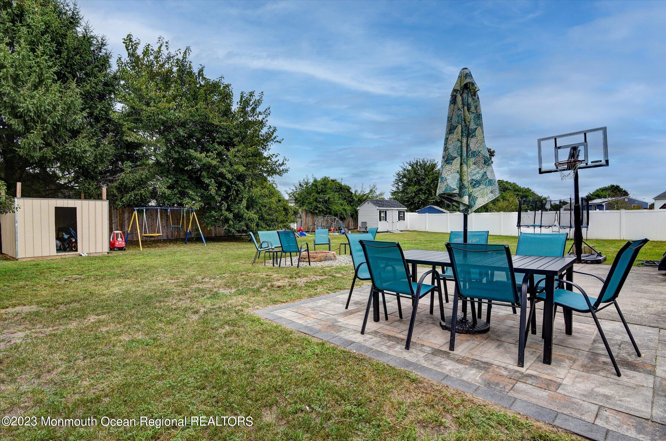 3 Albatross Drive Howell, NJ 07731 - Photo 27 of 29 a view of a house with backyard and a sitting area
