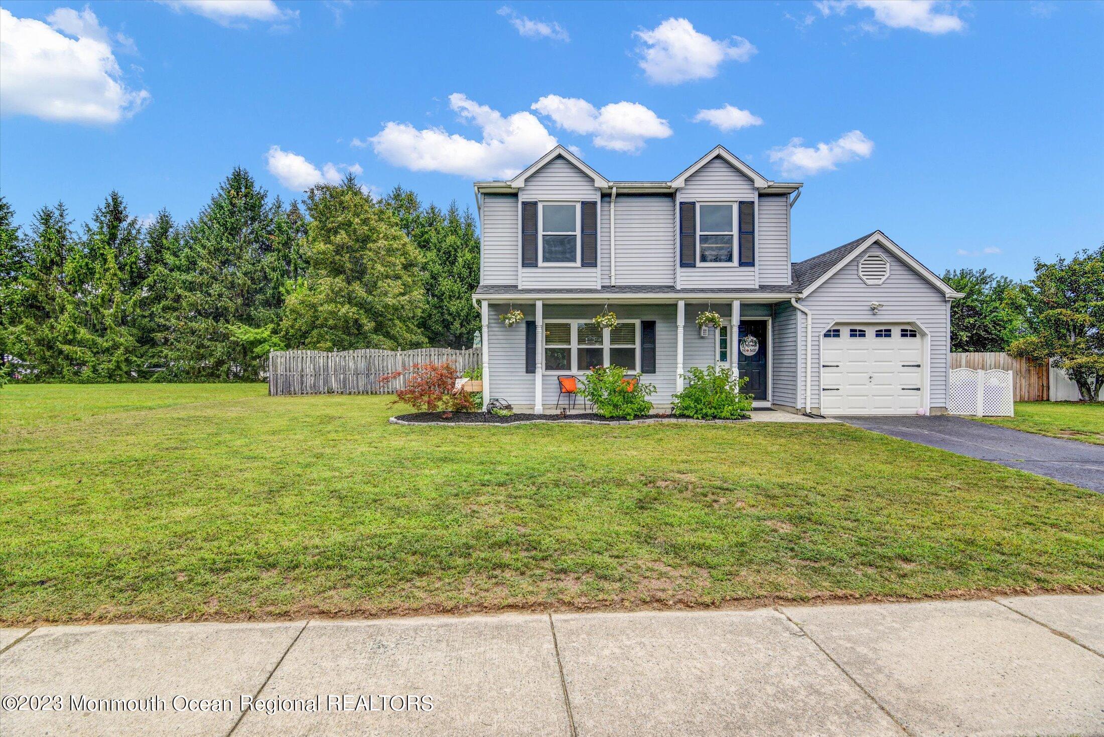 3 Albatross Drive Howell, NJ 07731 - Photo 3 of 29 a front view of a house with garden