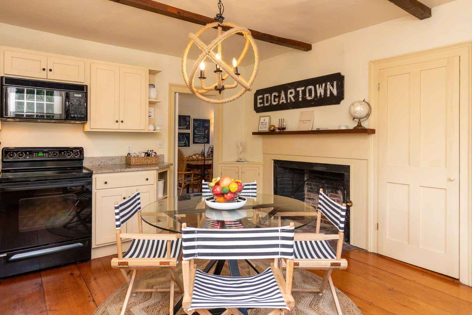 10 Peases Point Way North Edgartown, MA 02539 - Photo 19 of 45 a kitchen with a sink and a stove with wooden floor