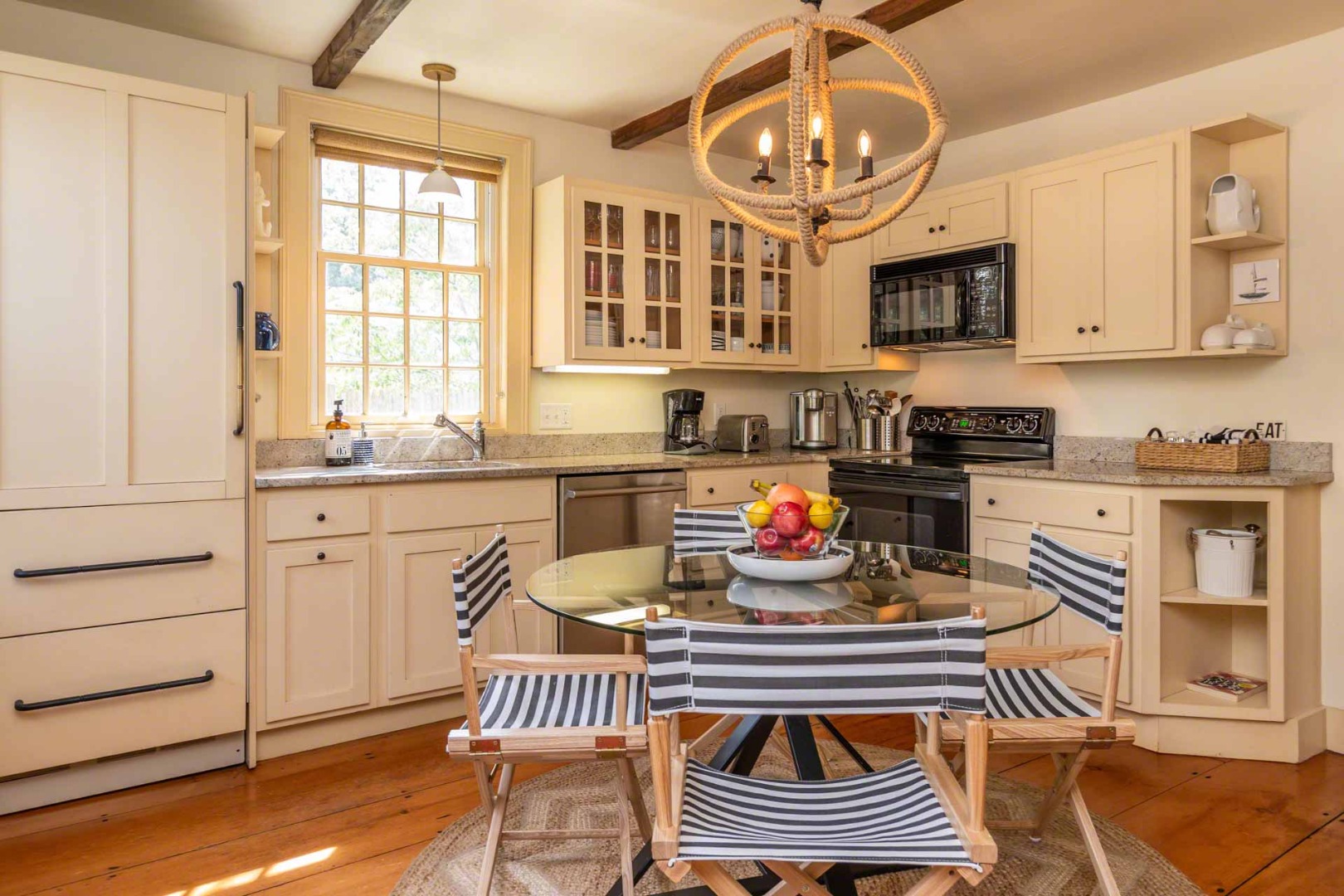 10 Peases Point Way North Edgartown, MA 02539 - Photo 20 of 45 a kitchen with stainless steel appliances a stove a sink and cabinets