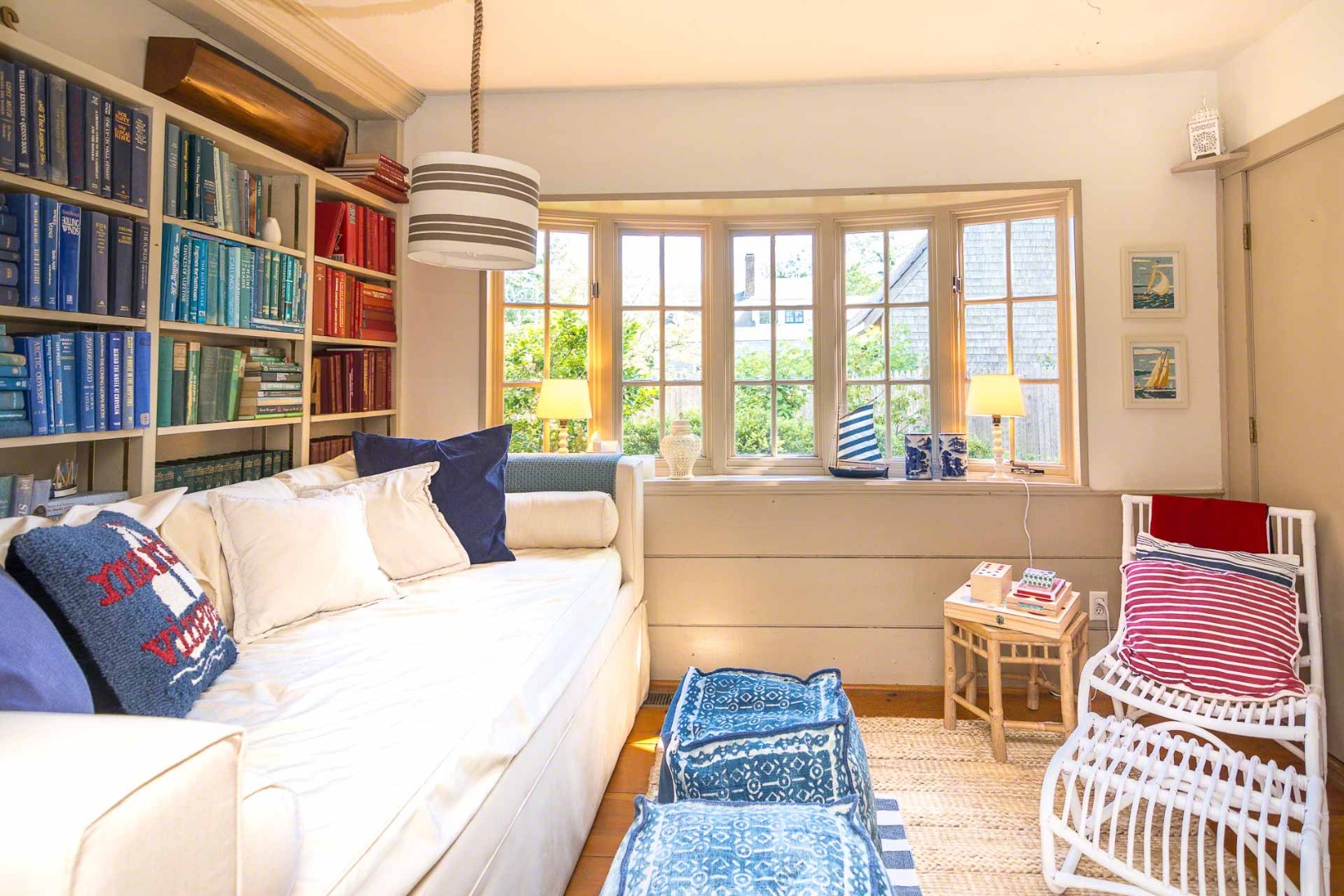 10 Peases Point Way North Edgartown, MA 02539 - Photo 23 of 45 a living room with a couch and bookshelf
