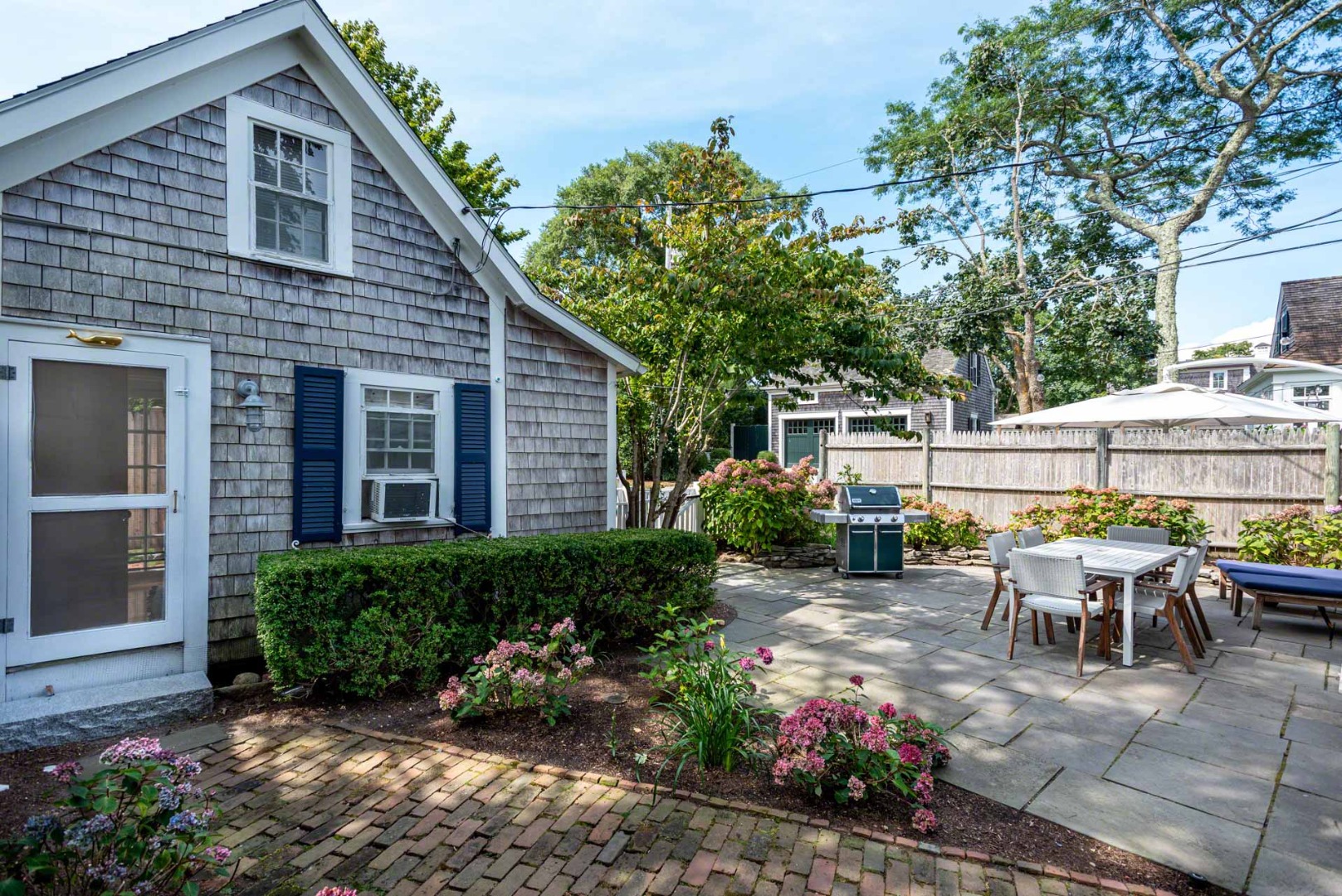 10 Peases Point Way North Edgartown, MA 02539 - Photo 37 of 45 a view of a house with backyard sitting area and garden