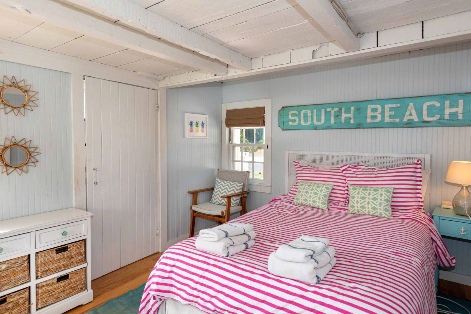 10 Peases Point Way North Edgartown, MA 02539 - Photo 38 of 45 a bedroom with a bed and a dresser in it