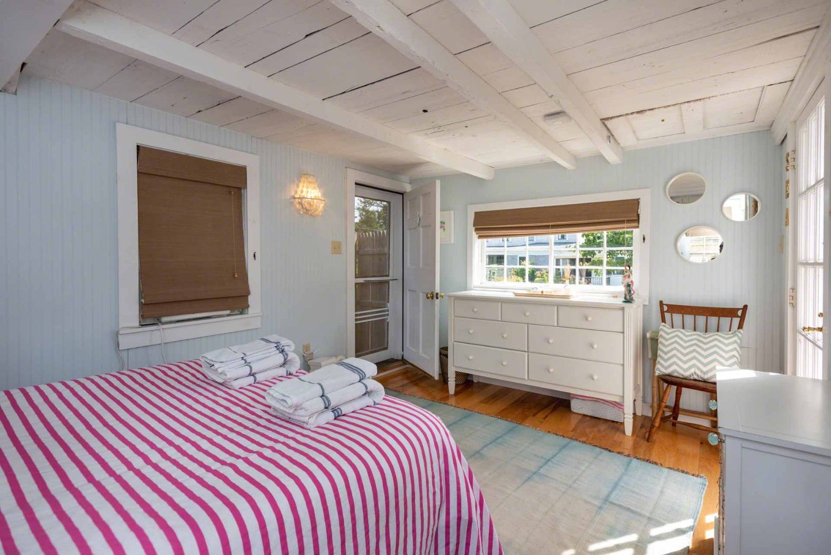 10 Peases Point Way North Edgartown, MA 02539 - Photo 39 of 45 a bedroom with a bed and a window