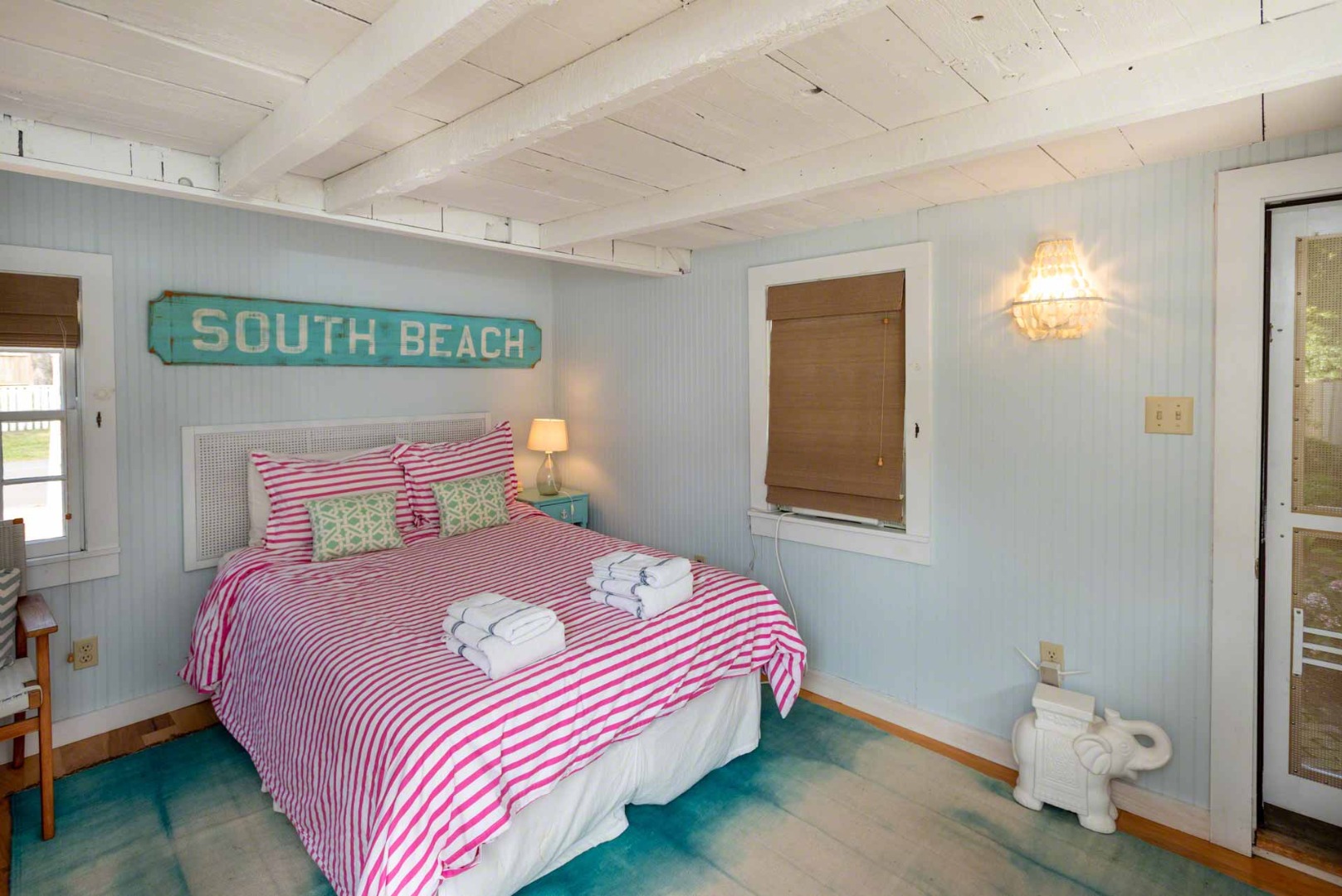 10 Peases Point Way North Edgartown, MA 02539 - Photo 40 of 45 a bedroom with a bed and wooden floor