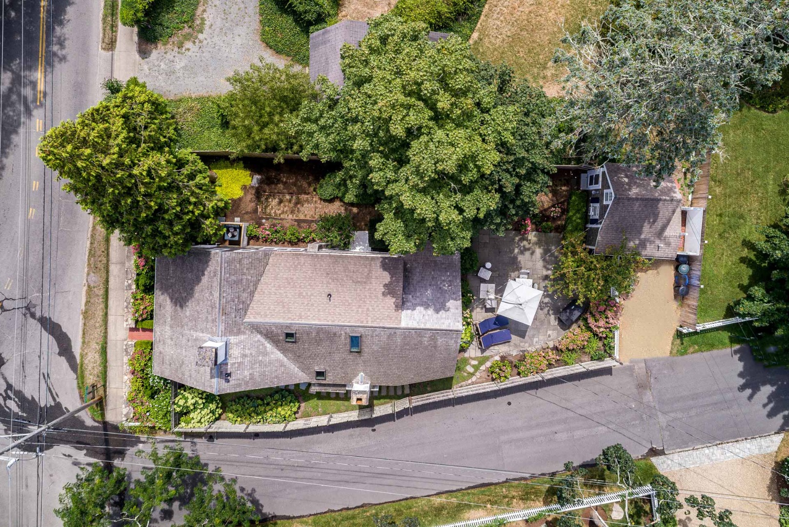 10 Peases Point Way North Edgartown, MA 02539 - Photo 5 of 45 an aerial view of a house with a yard and large trees
