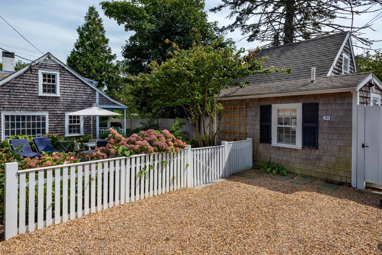 10 Peases Point Way North Edgartown, MA 02539 - Photo 44 of 45 a front view of house with deck and yard