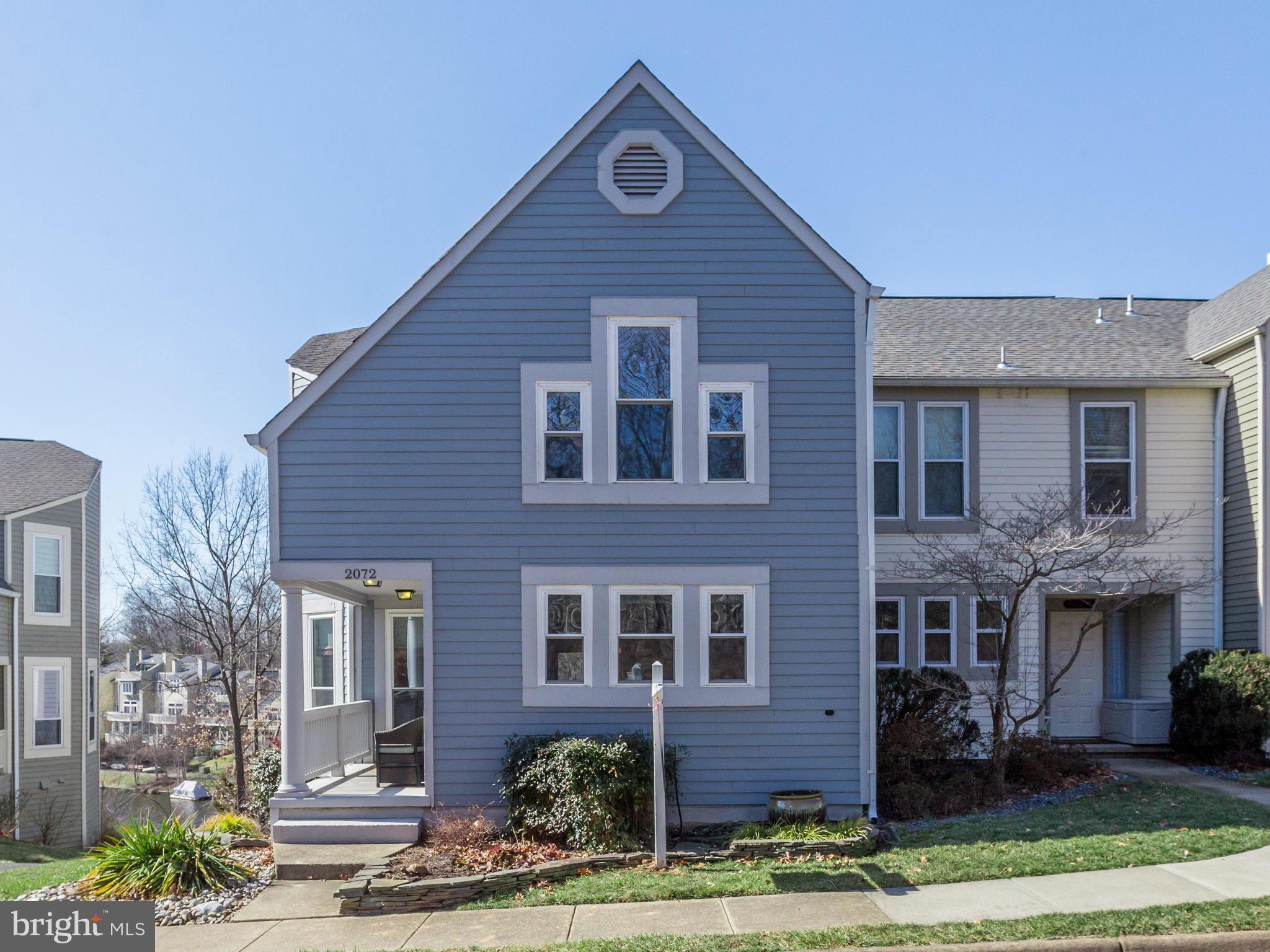 2072 Lake Audubon Court Reston, VA 20191 - Photo 1 of 30 a front view of a house with garden