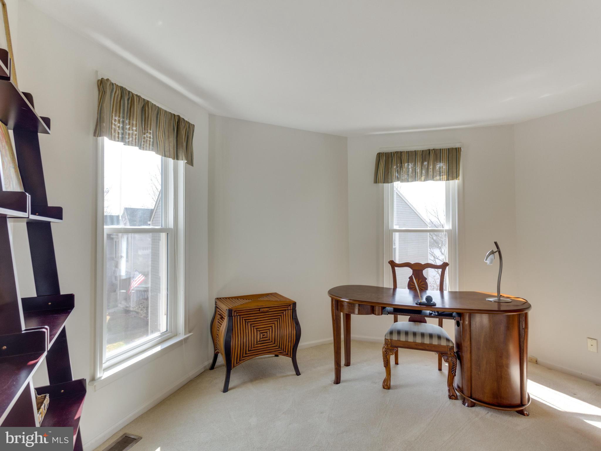 2072 Lake Audubon Court Reston, VA 20191 - Photo 19 of 30 a view of a workspace with furniture and a window
