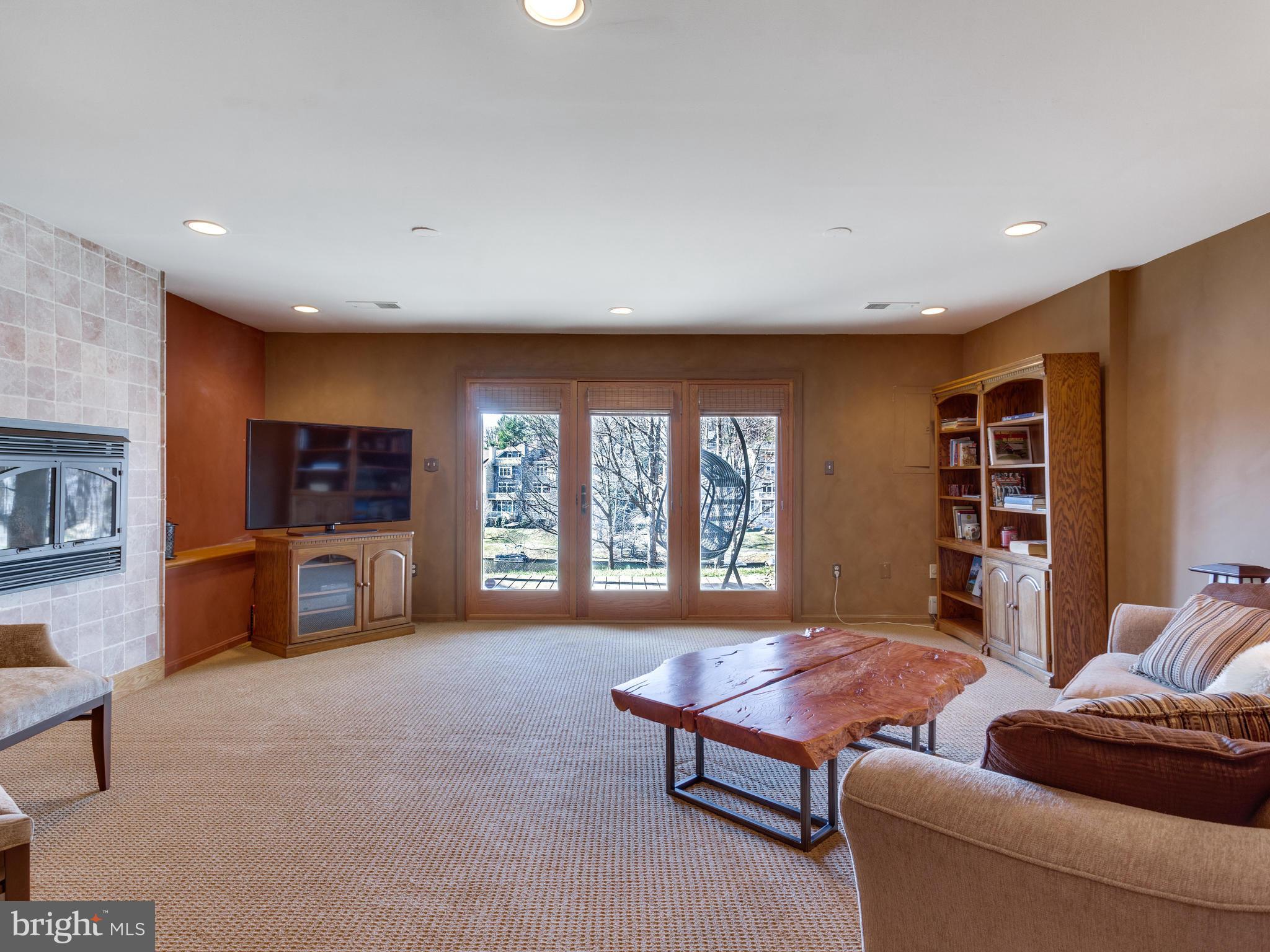 2072 Lake Audubon Court Reston, VA 20191 - Photo 21 of 30 a living room with furniture and a flat screen tv
