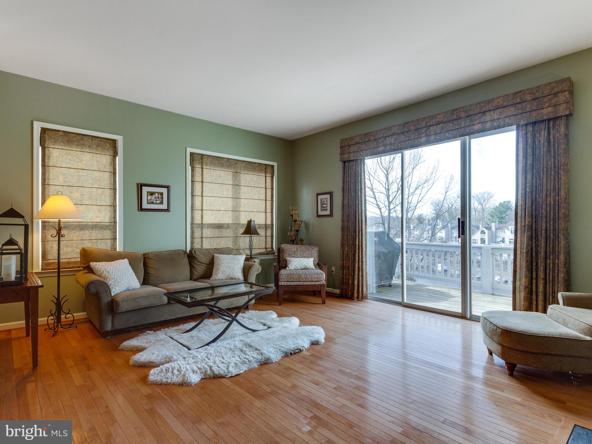 2072 Lake Audubon Court Reston, VA 20191 - Photo 8 of 30 a living room with furniture and a large window