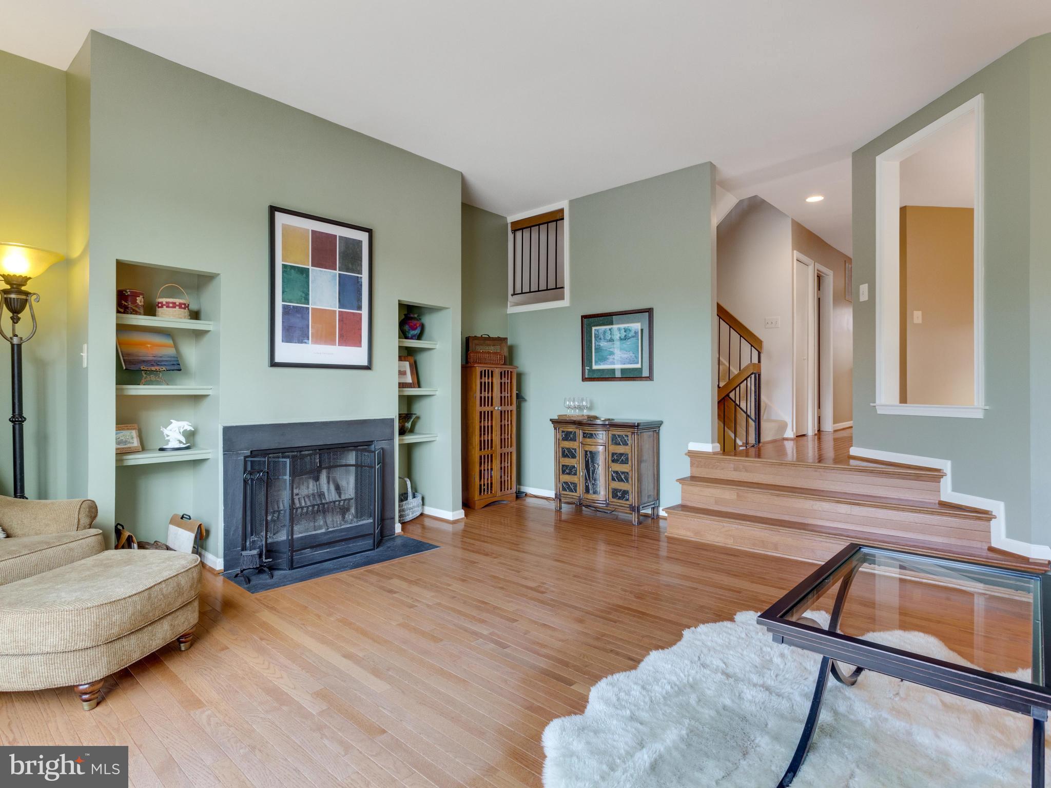 2072 Lake Audubon Court Reston, VA 20191 - Photo 9 of 30 a living room with furniture and a fireplace