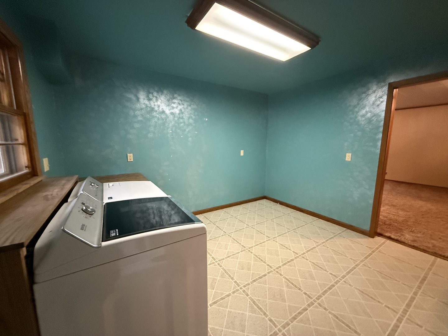 1048 Warren Street Henry, IL 61537 - Photo 20 of 26 a bedroom with a bed and a chandelier