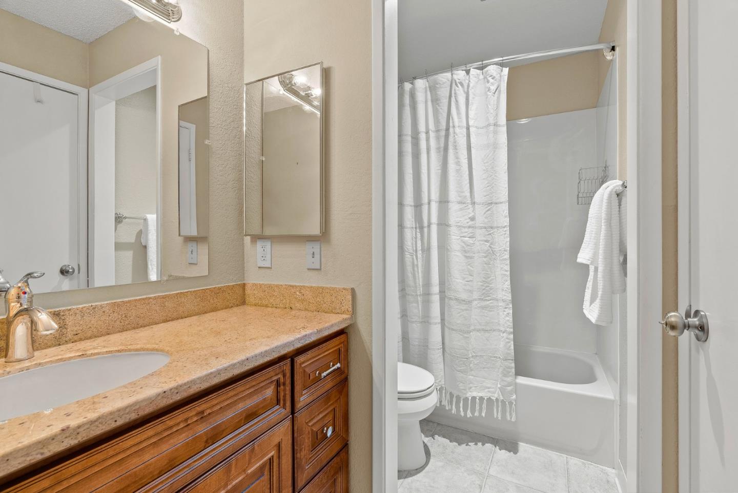 230 Stonegate Circle San Jose, CA 95110 - Photo 13 of 18 a bathroom with a sink a toilet and shower