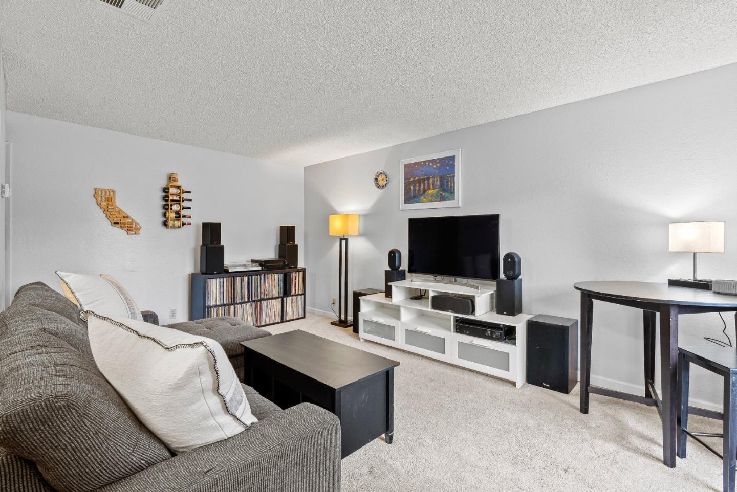 230 Stonegate Circle San Jose, CA 95110 - Photo 3 of 18 a living room with furniture and a flat screen tv