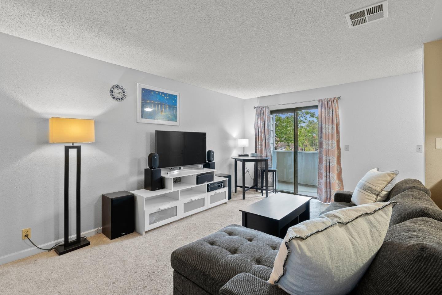 230 Stonegate Circle San Jose, CA 95110 - Photo 5 of 18 a living room with furniture and a flat screen tv