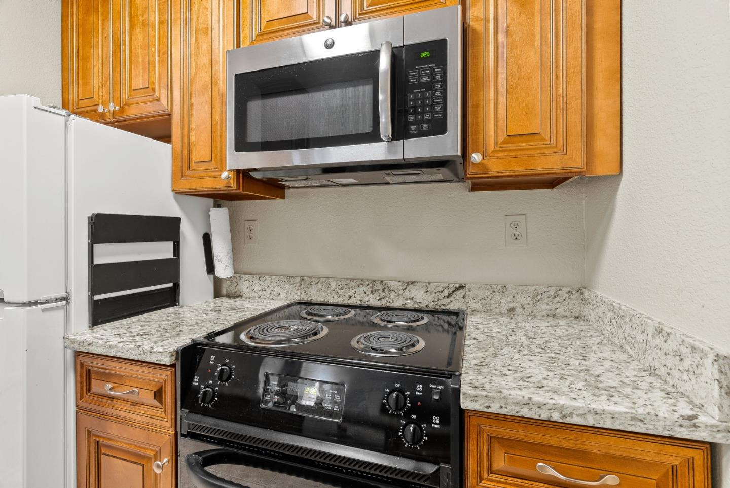 230 Stonegate Circle San Jose, CA 95110 - Photo 9 of 18 a stove top oven sitting inside of a kitchen