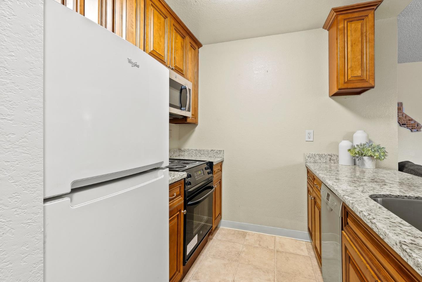 230 Stonegate Circle San Jose, CA 95110 - Photo 10 of 18 a utility room with cabinets washer and dryer
