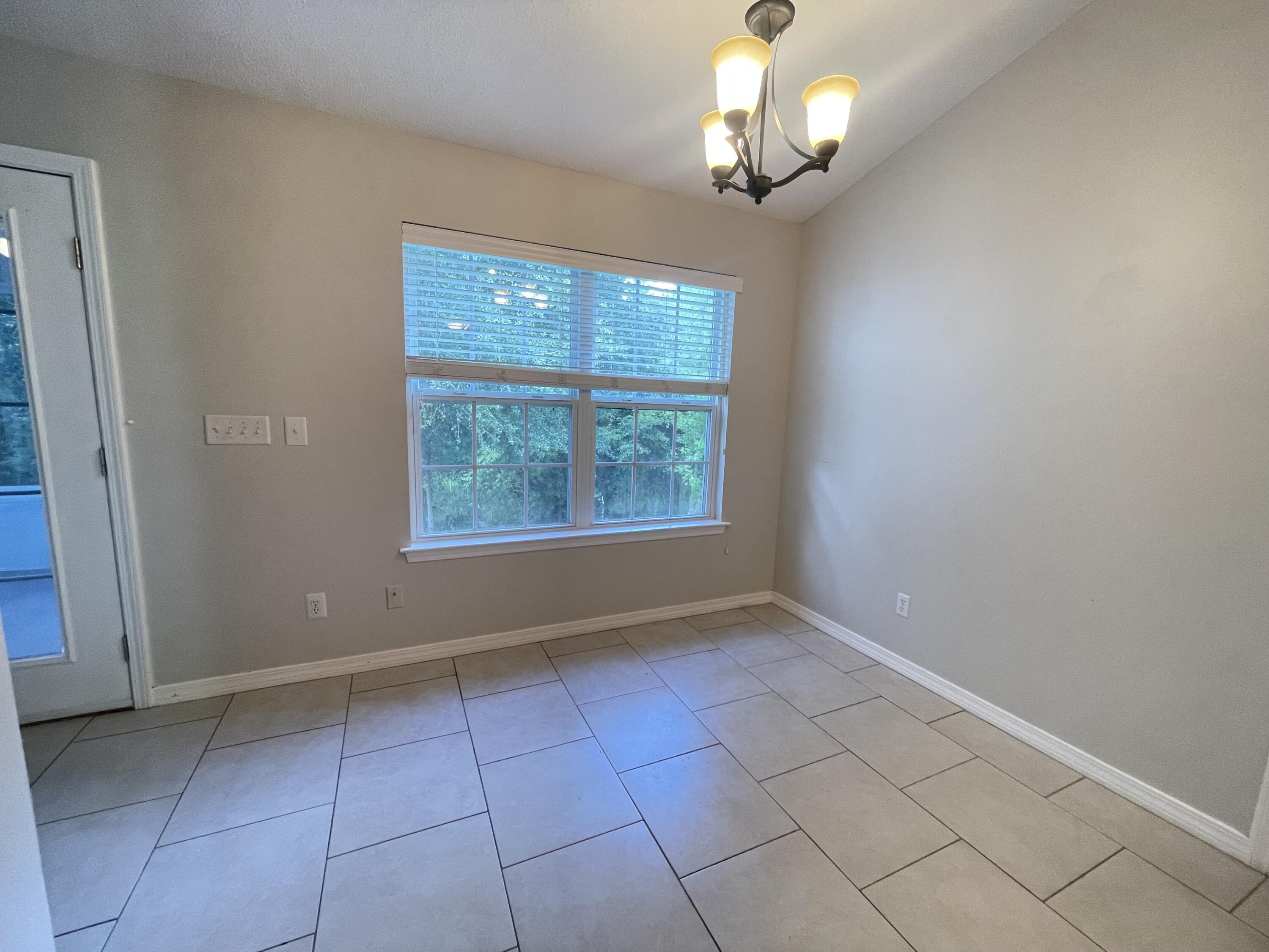 728 Riva Ridge Drive Crestview, FL 32539 - Photo 14 of 26 a view of an empty room with a window