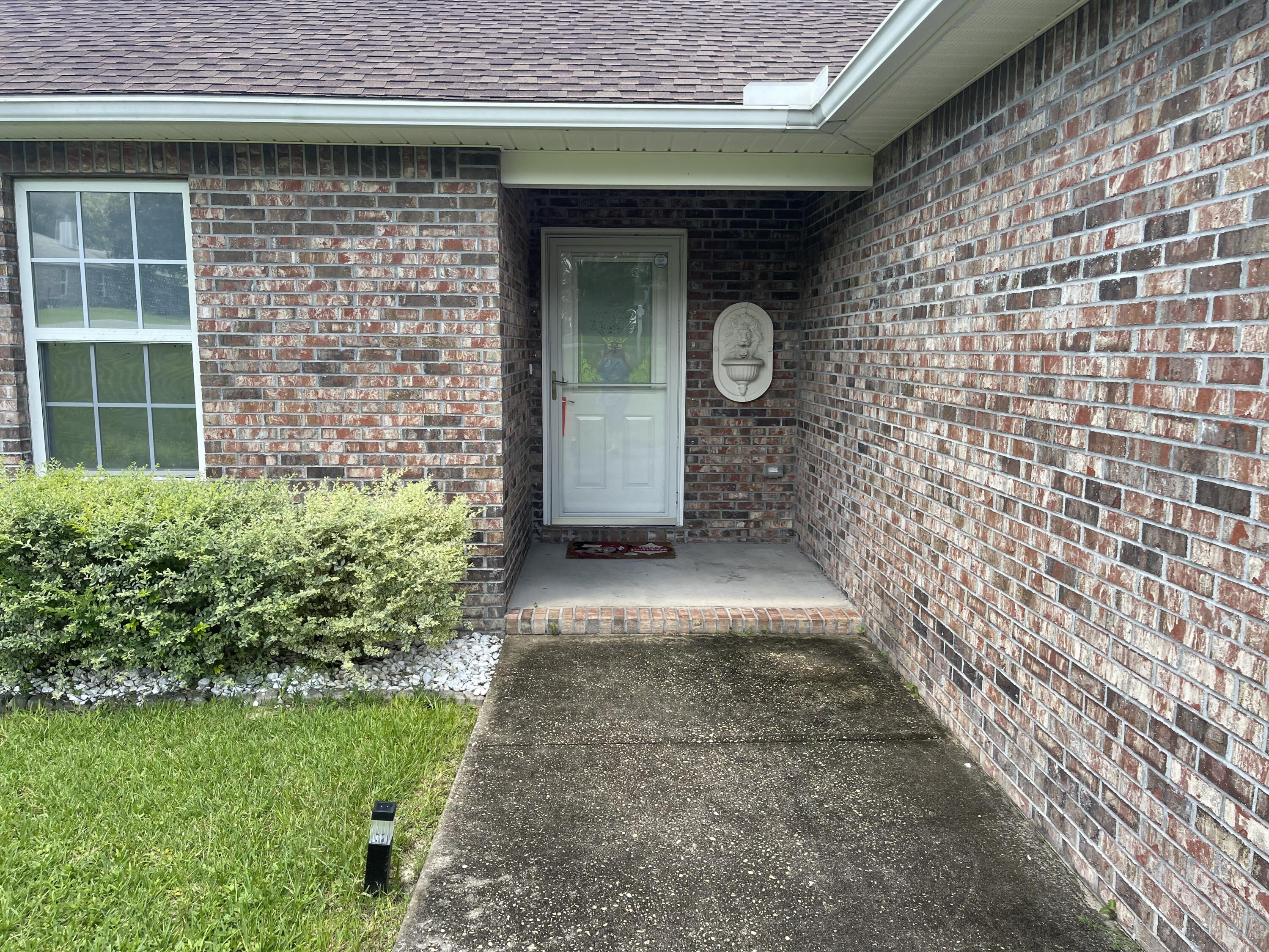 728 Riva Ridge Drive Crestview, FL 32539 - Photo 2 of 26 a view of entrance gate of a house